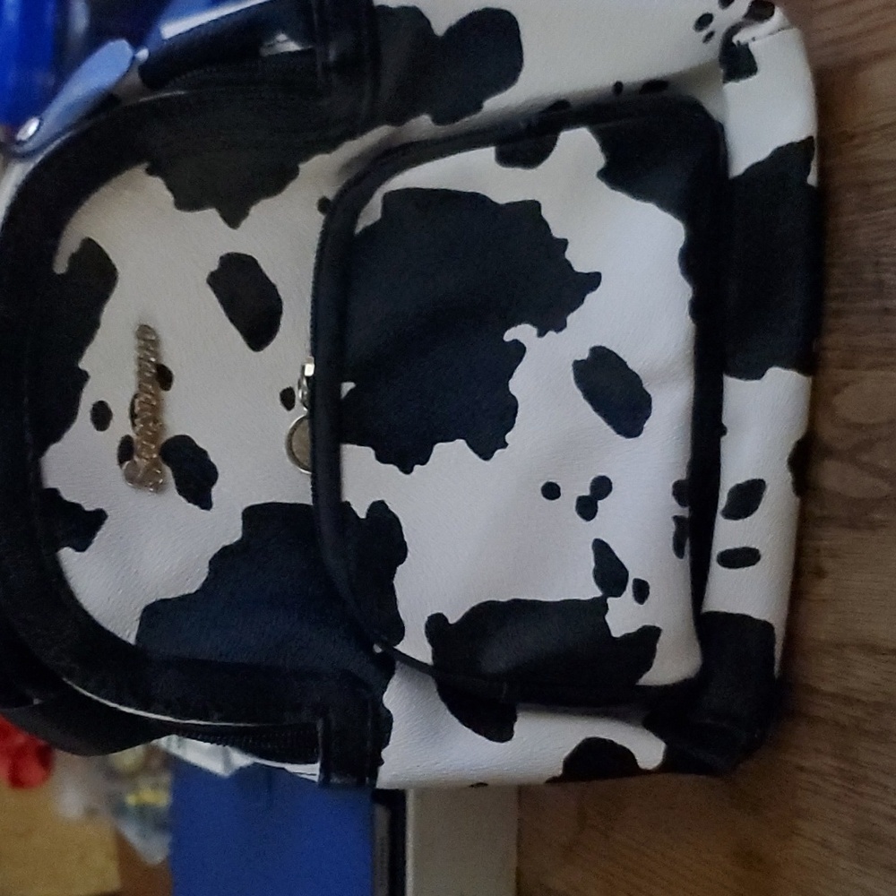 Cow print backpack purse